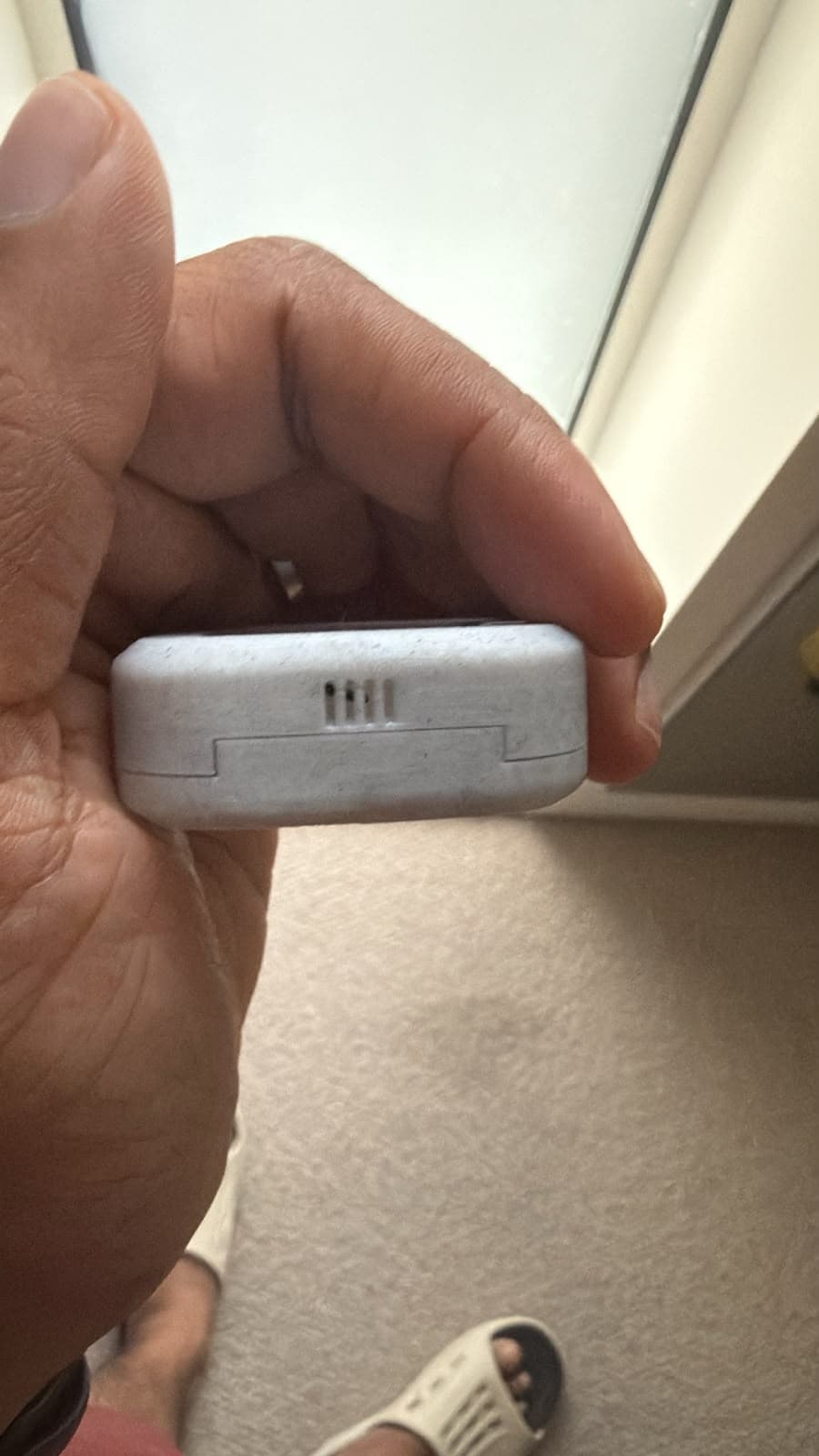 Bottom edge of the early Aira hardware prototype showing enclosure seams and an opening